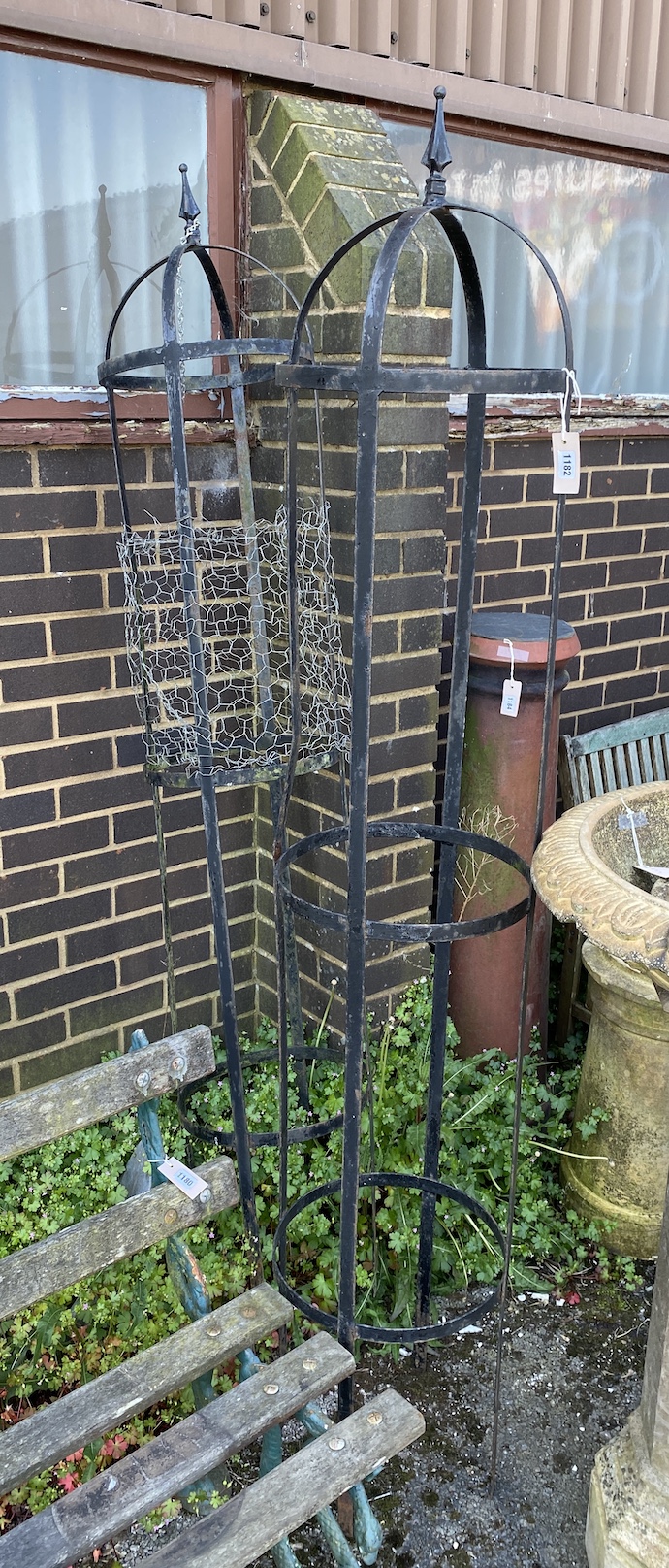 A pair of wrought iron garden growing frames, height 204cm